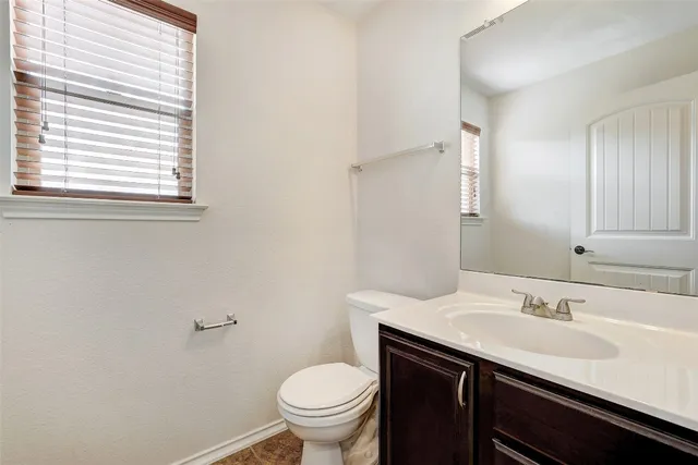 a view of an empty room with windows