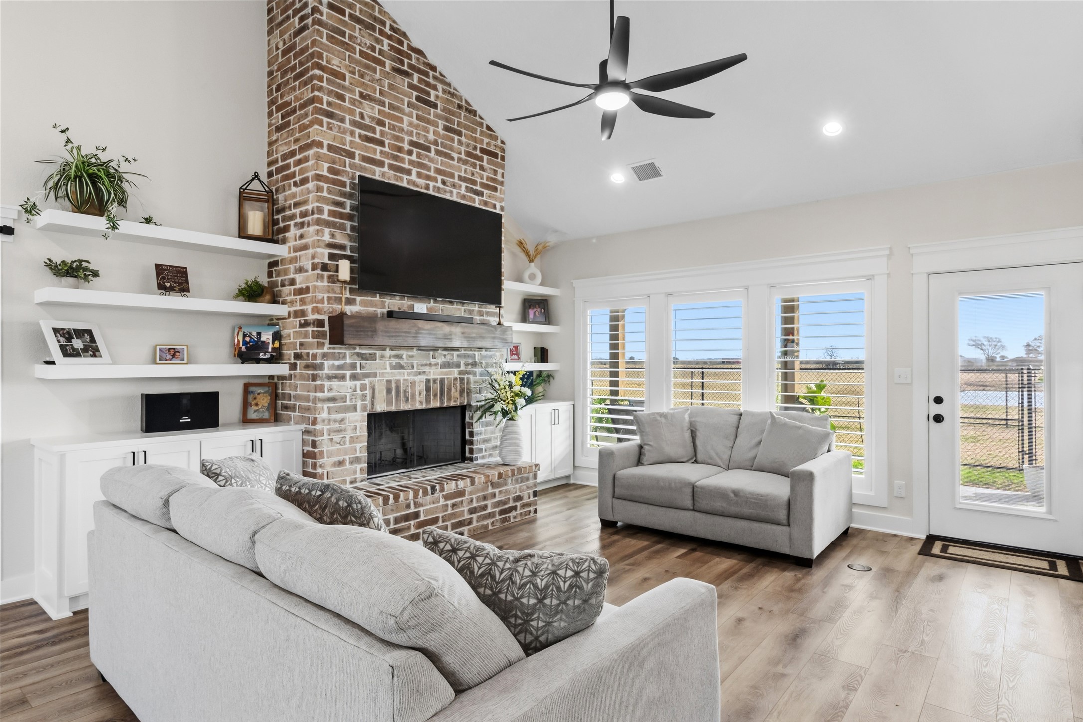 17637 Englin Road Winnie, TX 77665 - Photo 13 of 37 a living room with furniture fireplace and flat screen tv