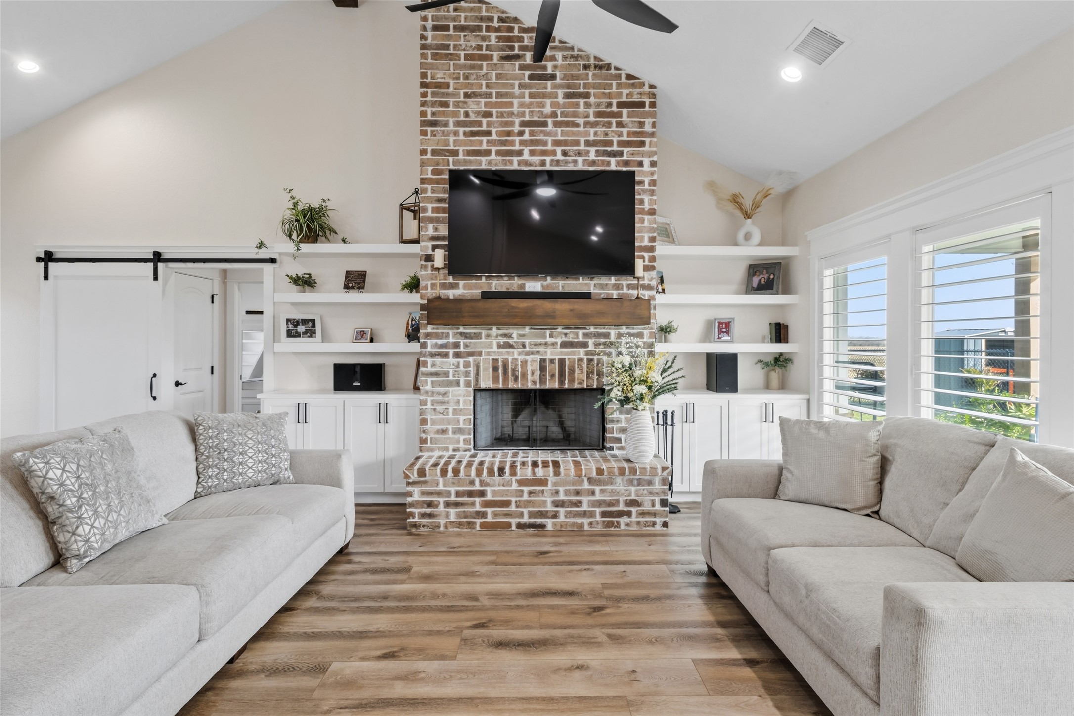 17637 Englin Road Winnie, TX 77665 - Photo 14 of 37 a living room with furniture a rug and a fireplace