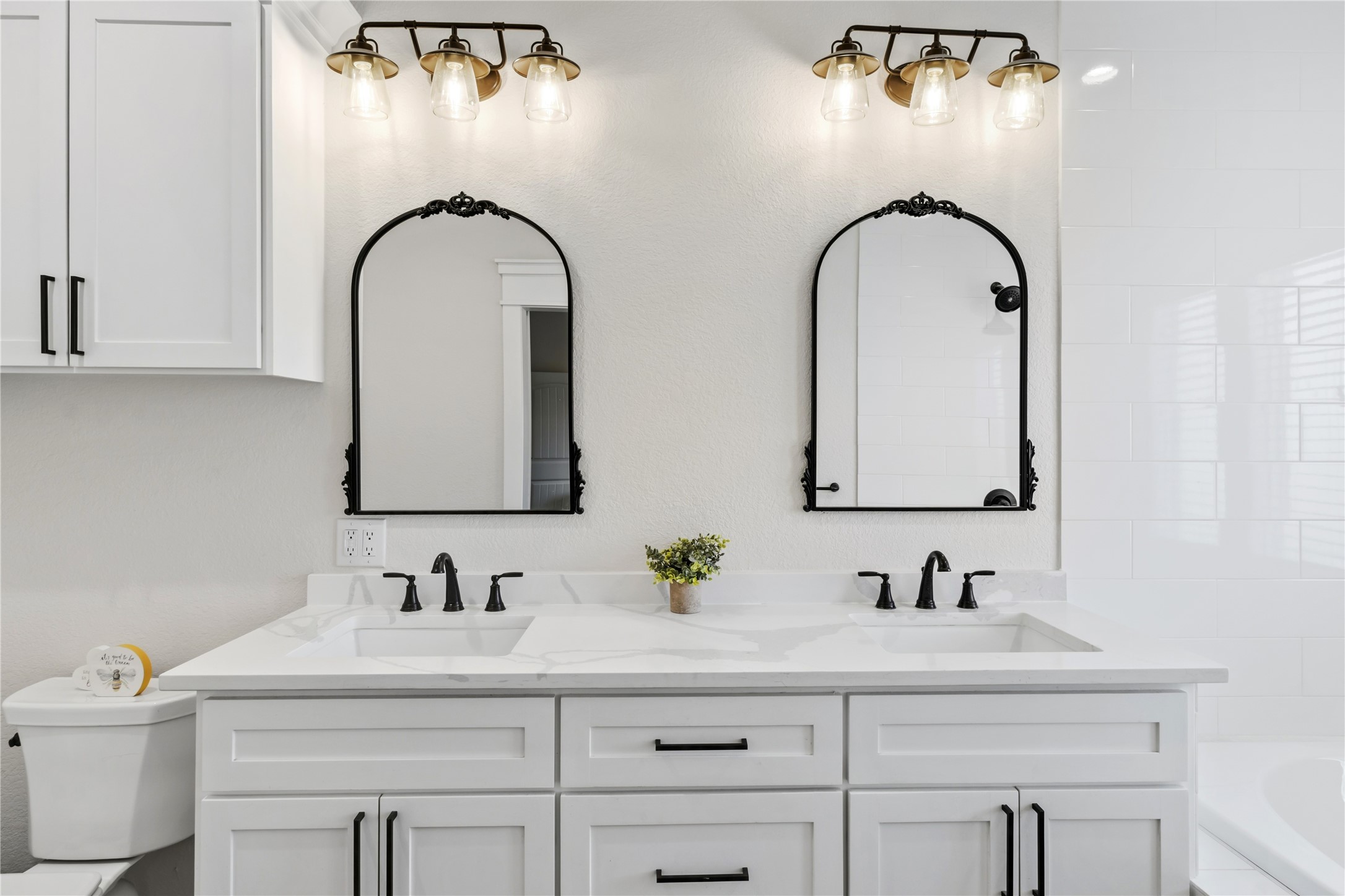 17637 Englin Road Winnie, TX 77665 - Photo 16 of 37 a bathroom with a double vanity sink and a