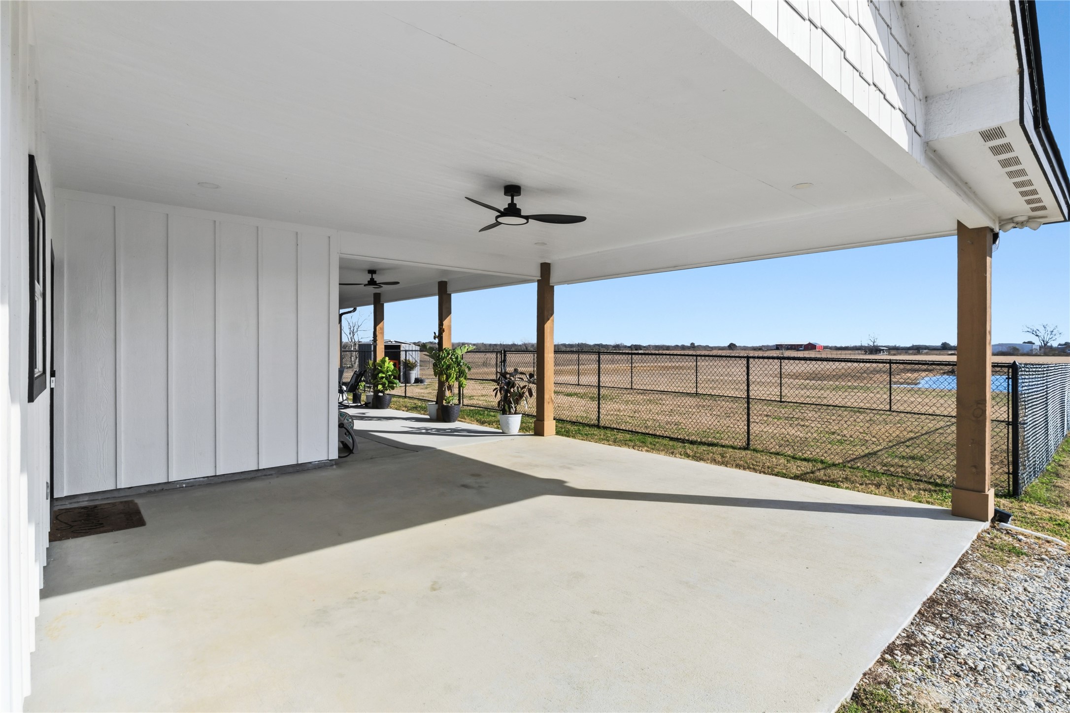 17637 Englin Road Winnie, TX 77665 - Photo 28 of 37 a view of a porch with furniture and floor to ceiling window