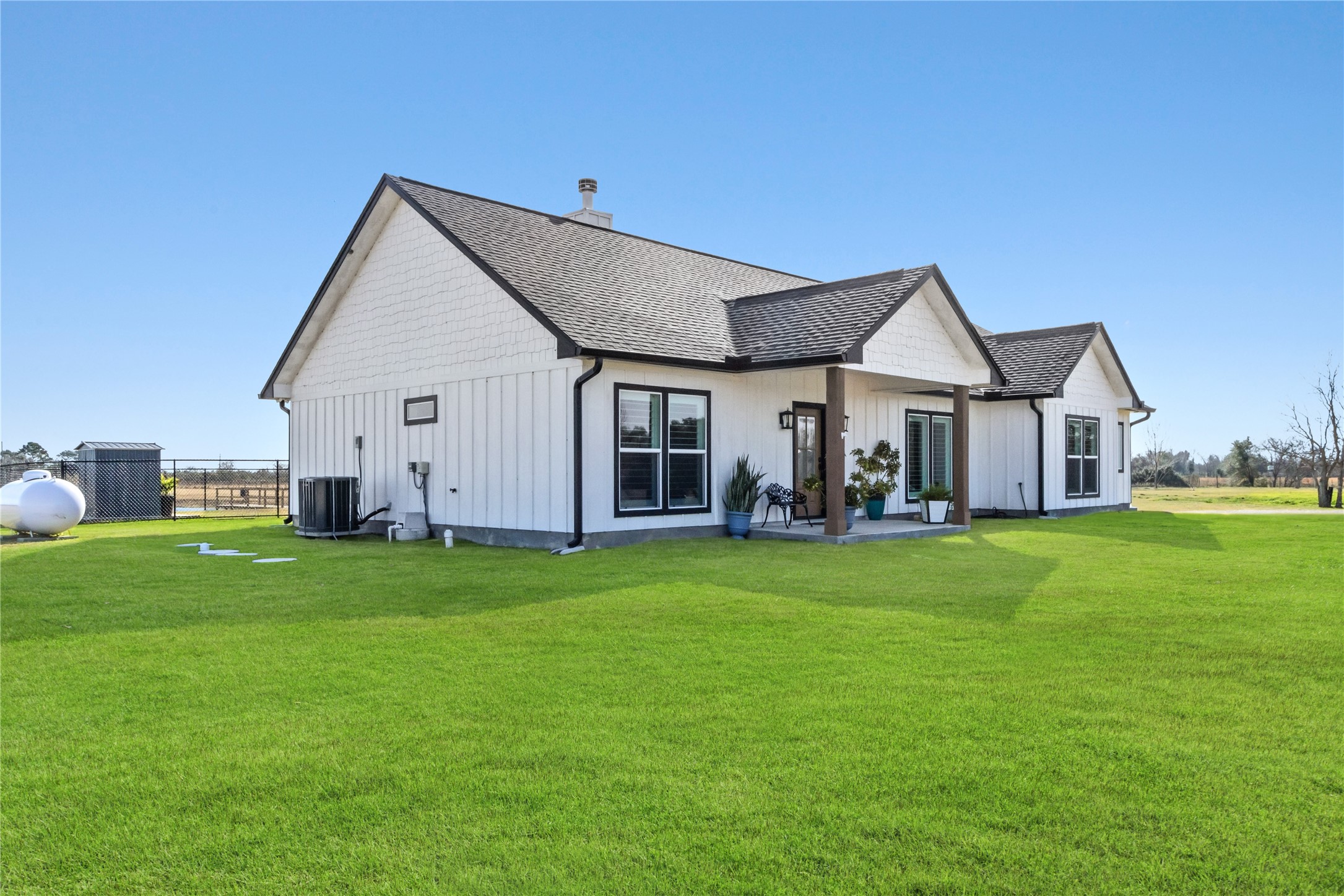 17637 Englin Road Winnie, TX 77665 - Photo 29 of 37 a front view of a house with a garden and porch