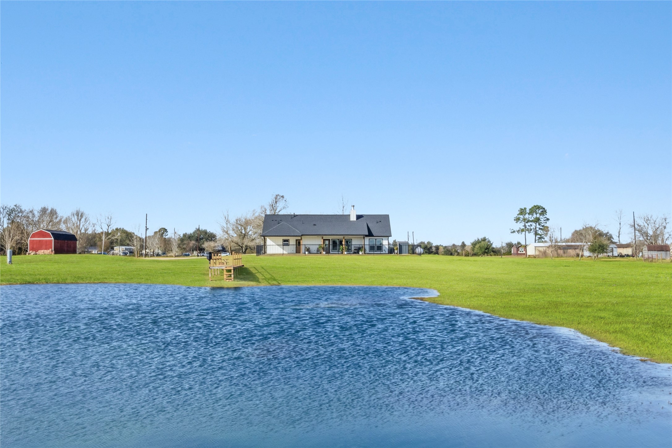 17637 Englin Road Winnie, TX 77665 - Photo 35 of 37 a view of a house with a yard and a large pool