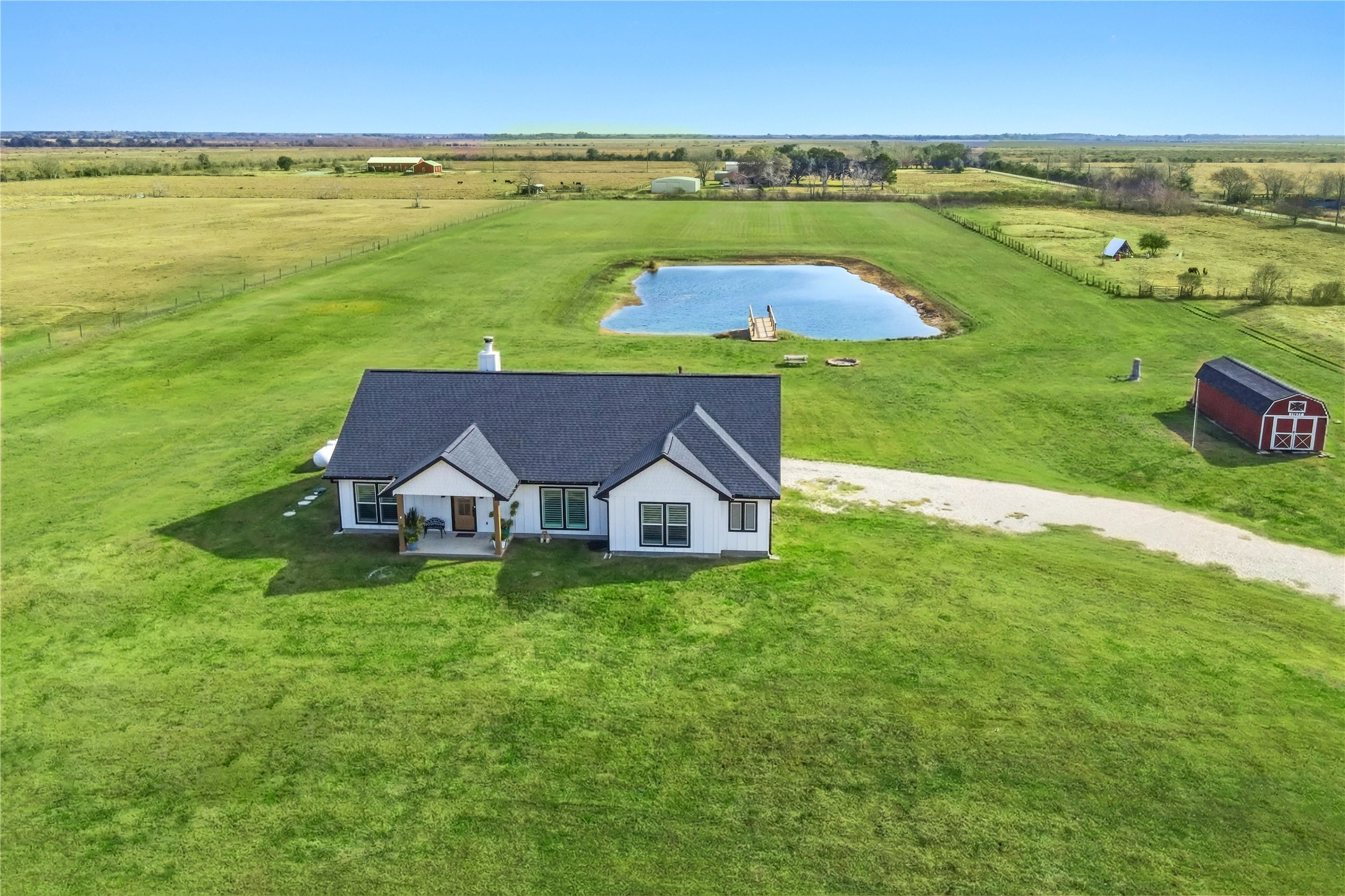 17637 Englin Road Winnie, TX 77665 - Photo 5 of 37 a view of a house with big yard and a large pool