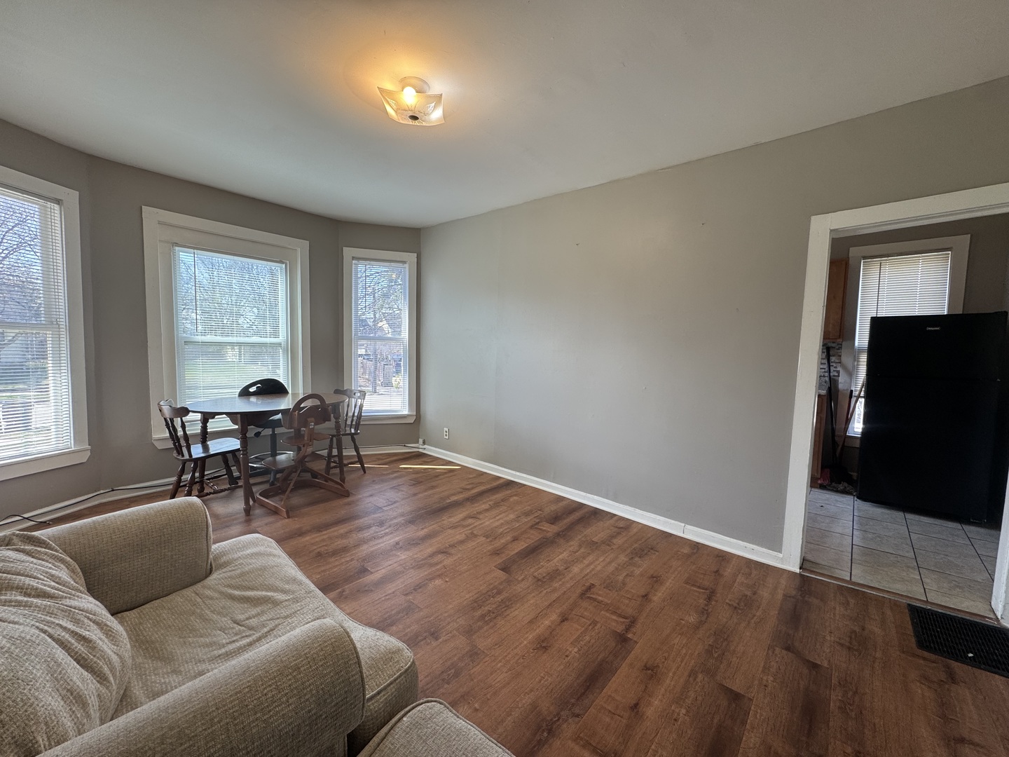 370 Bent Street, Unit 1 Elgin, IL 60120 - Photo 2 of 10 a living room with furniture and a flat screen tv