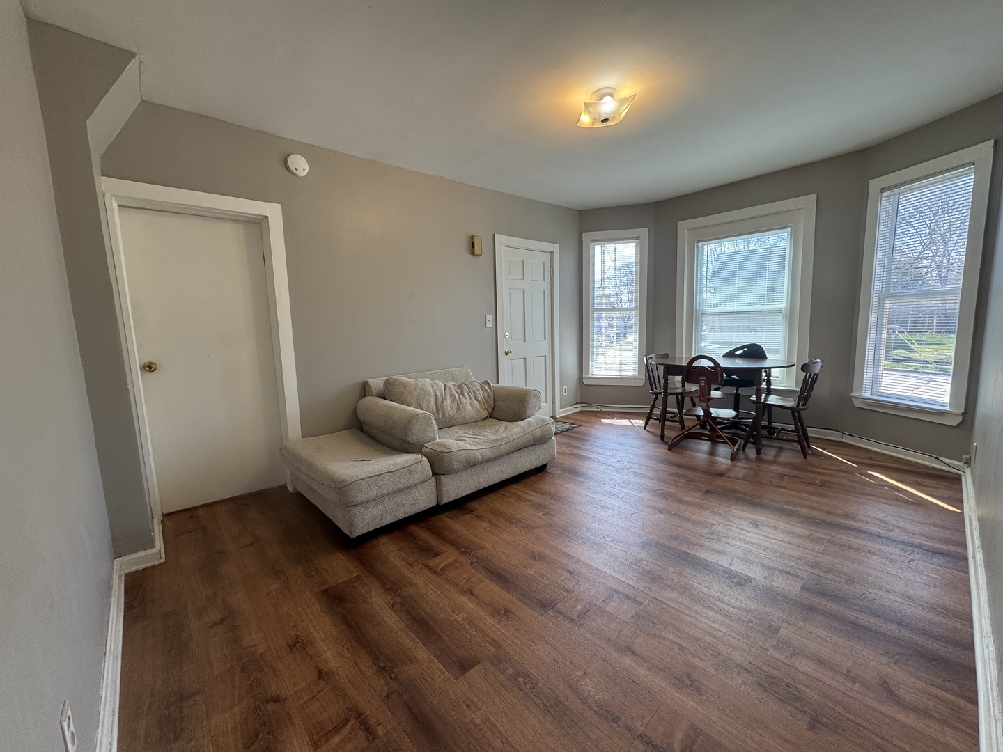 370 Bent Street, Unit 1 Elgin, IL 60120 - Photo 5 of 10 a living room with furniture and a wooden floor