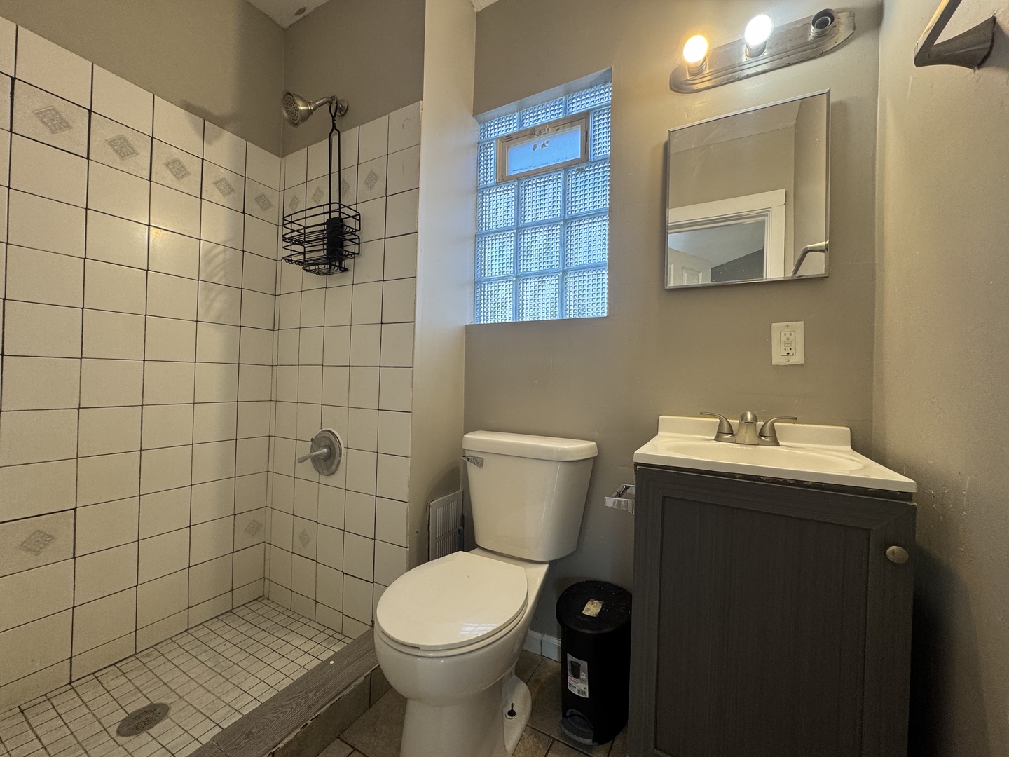 370 Bent Street, Unit 1 Elgin, IL 60120 - Photo 10 of 10 a bathroom with a sink toilet and shower