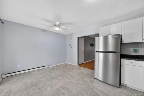 a kitchen with stainless steel appliances a refrigerator and a stove top oven