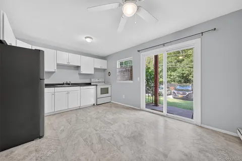 a kitchen with stainless steel appliances granite countertop a refrigerator sink and cabinets