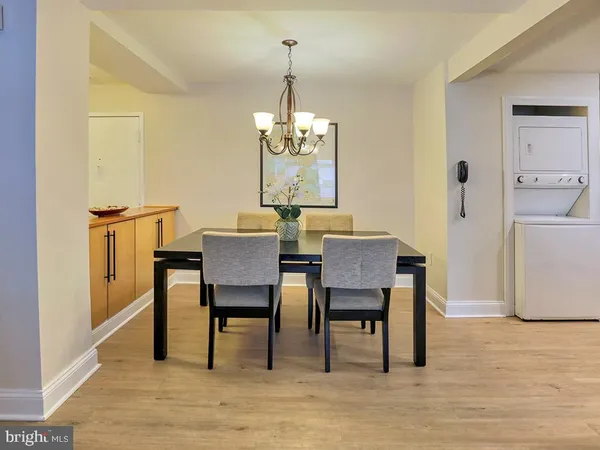 a kitchen with a sink a refrigerator and cabinets
