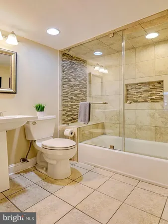 a bedroom with a bed and a table chair