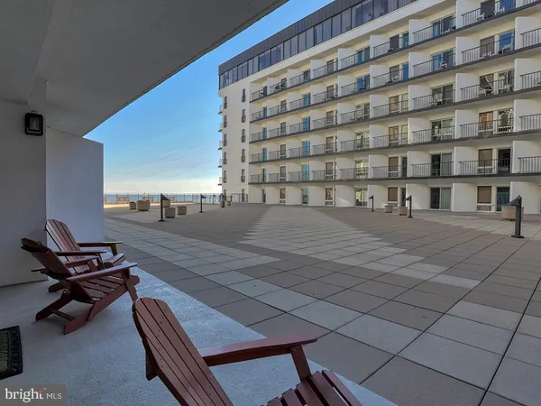 a view of swimming pool with outdoor seating