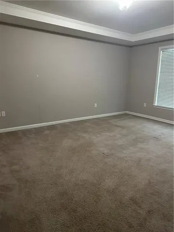 a bathroom with a shower a mirror and a sink