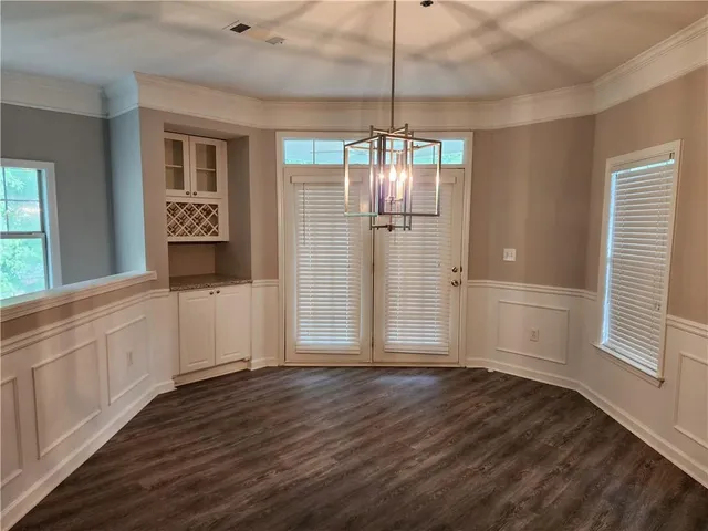 a kitchen with stainless steel appliances granite countertop a refrigerator and a stove