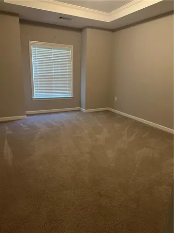 an empty room with a empty space and window