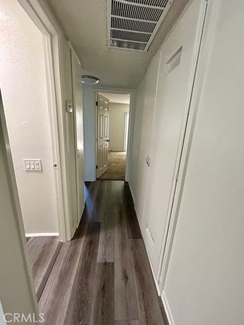 68460 Kings Road, Unit C Cathedral City, CA 92234 - Photo 13 of 18 a view of a hallway with wooden floor and staircase