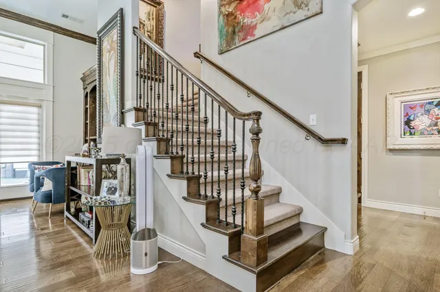 a view of entryway dining room and hall with wooden floor