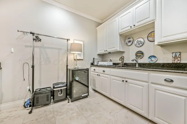 a kitchen with stainless steel appliances granite countertop a sink and cabinets