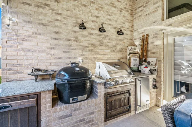 a kitchen with a stove and a wooden floor
