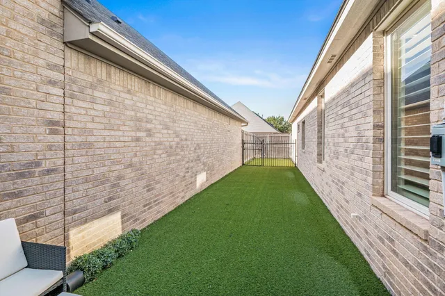 a backyard of a house with lots of green space