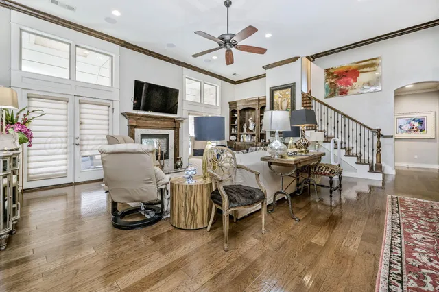 a living room with furniture flat screen tv and a fireplace