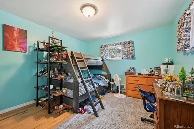 a bathroom with a sink shower and a mirror