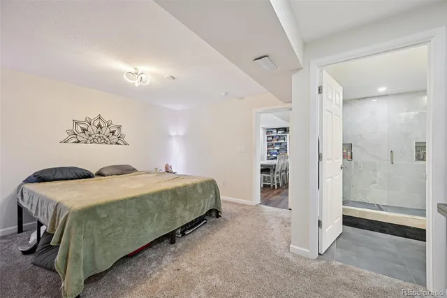 a bedroom with a bed and a dresser