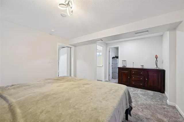 a bedroom with a bed and a table in it