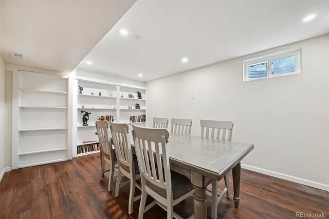 a view of a livingroom with furniture and wooden floor