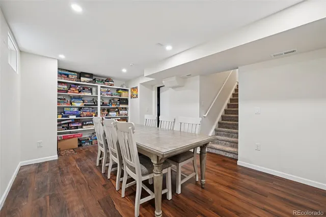 a view of a house with backyard and a patio
