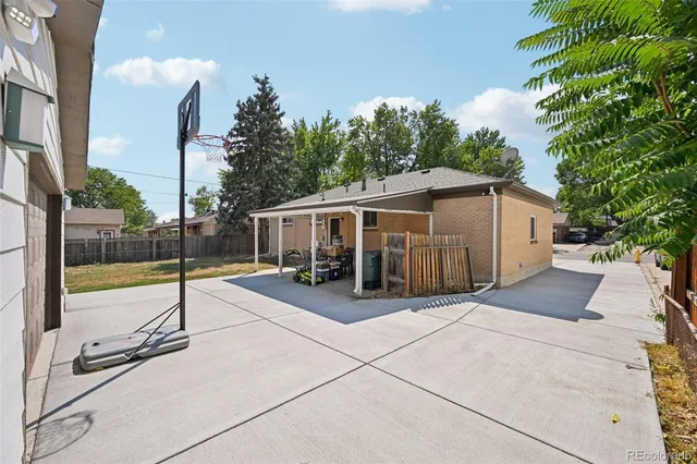 a front view of a house with outdoor seating and plants