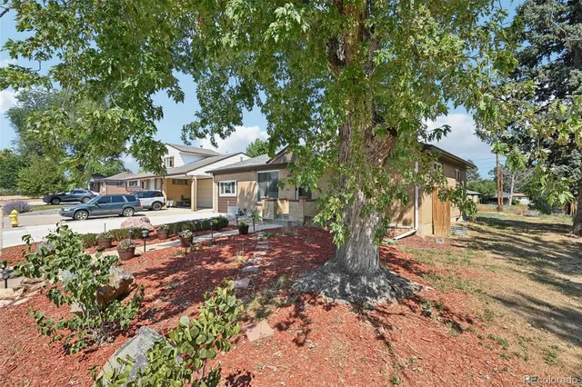 a front view of a house with outdoor seating