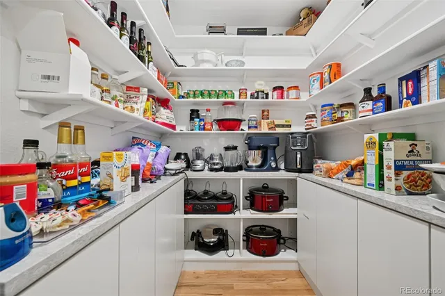 a view of kitchen with cabinets table and chairs
