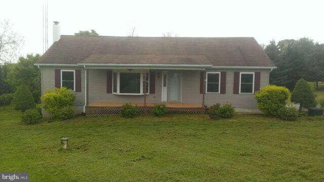 12129 Houck Road Union Bridge, MD 21791 - Photo 1 of 12 a house that has a tree in front of it