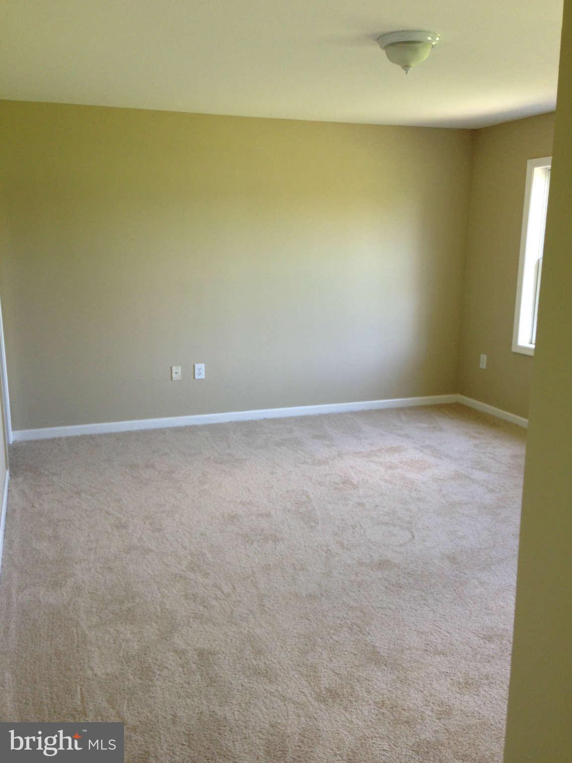 12129 Houck Road Union Bridge, MD 21791 - Photo 2 of 12 an empty room with a natural light