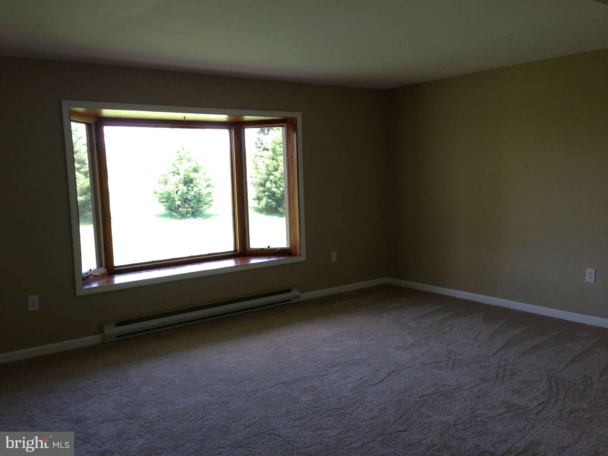 12129 Houck Road Union Bridge, MD 21791 - Photo 3 of 12 an empty room with a window