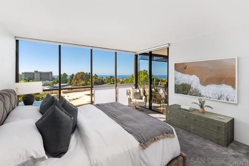 2500 Torrey Pines Road, Unit 402 La Jolla, CA 92037 - Photo 2 of 21 a spacious bedroom with a large window and a bed