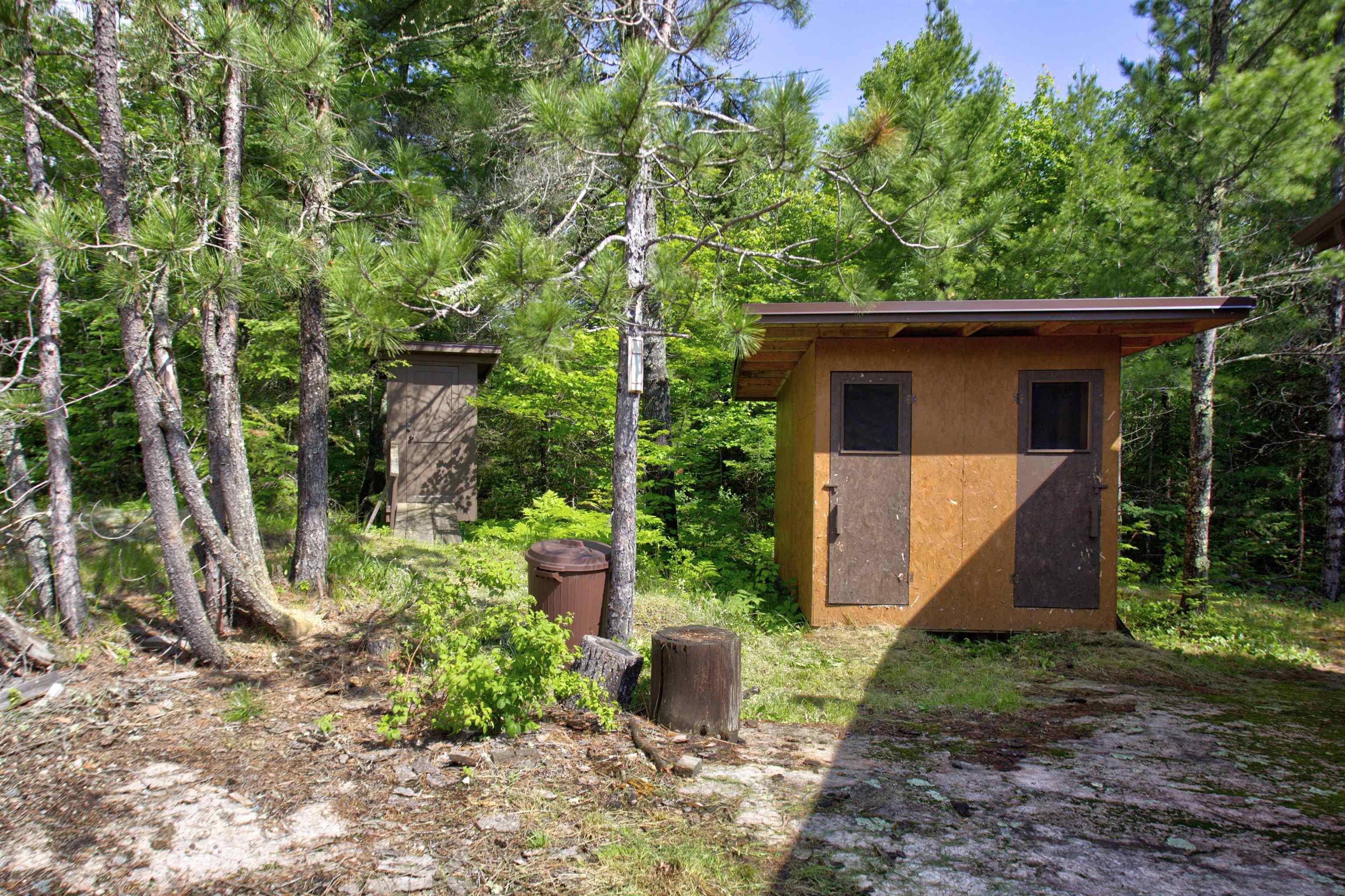 4194 Nels Lake Road Ely, MN 55731 - Photo 3 of 27 View of outdoor structure with a wooded view
