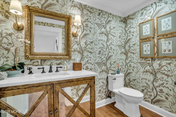 a living room with furniture a wooden floor and a floor to ceiling window