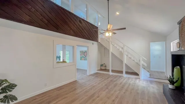 a view of an entryway with wooden floor