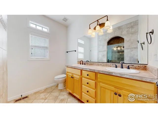 a living room with patio furniture and a garden