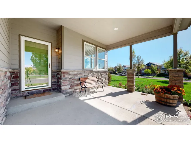 a view of a chairs and table in backyard