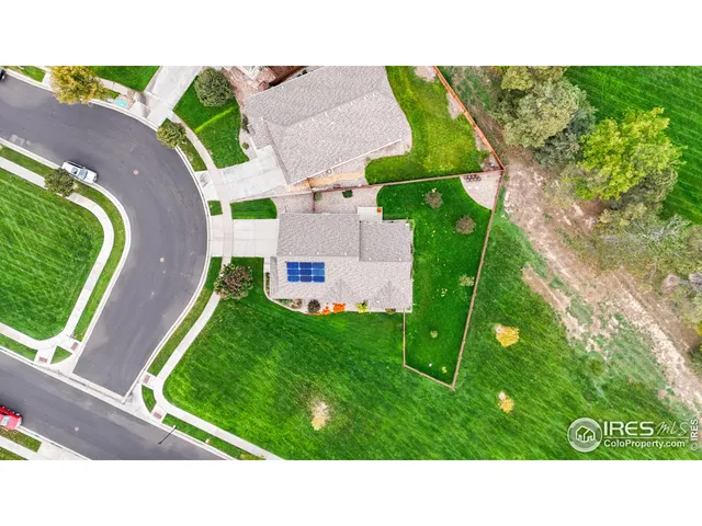 a view of residential houses with outdoor space and city view