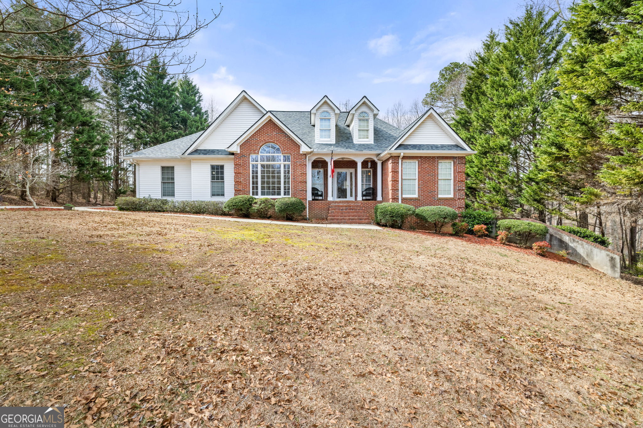 175 Springbrook Drive Cornelia, GA 30531 - Photo 1 of 1 a front view of a house with a yard and trees