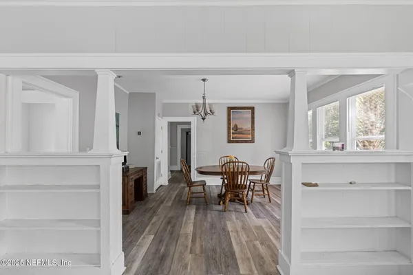 a view of a dining room with furniture window and wooden floor