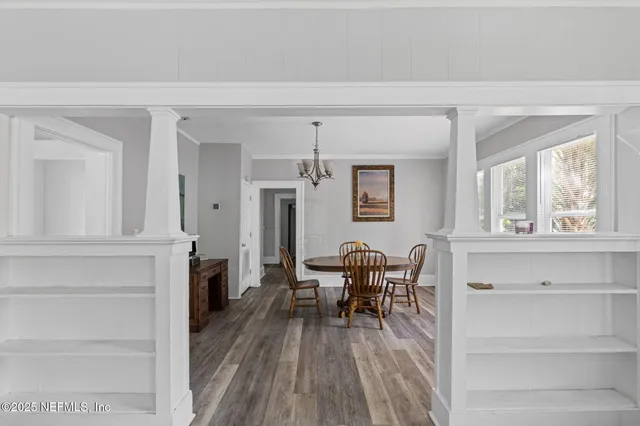 a view of a dining room with furniture window and wooden floor
