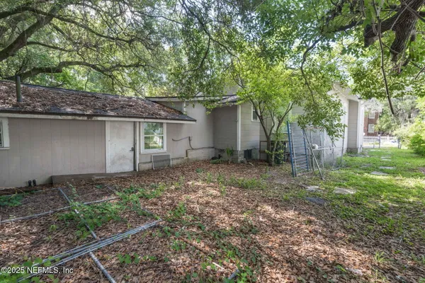 a backyard of a house with lots of green space