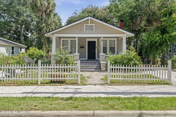 front view of a house with a small yard