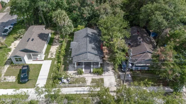 an aerial view of house with yard