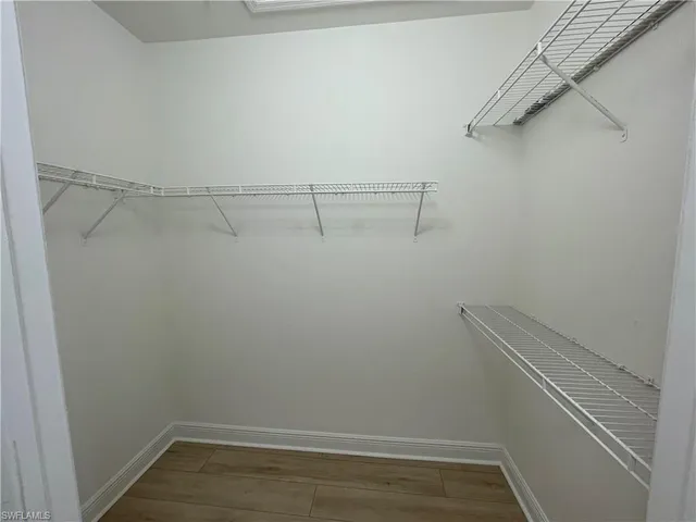 a view of an empty walk in closet